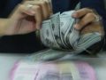 Grafik pergerakan nilai tukar rupiah terhadap dolar AS yang menunjukkan tren pelemahan di pasar spot.